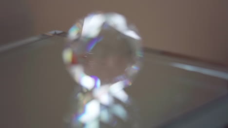 Macro-Rack-Focus-Push-in-onto-Crystal-on-Reflective-Glass