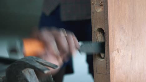 Carpenter-Chiselling-a-Door-in-a-House