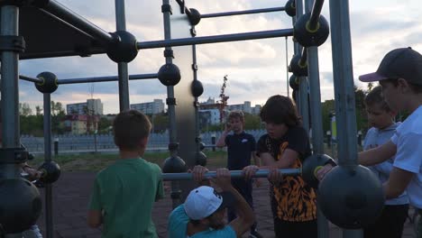 A-Man-Teaching-The-Children-The-Proper-Way-How-To-Do-The-Activity-At-The-Playgroung-In-Parkour-Training-At-Cluj-Romania---Wide-Shot