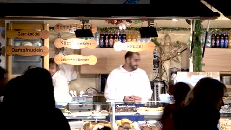 Timelapse-of-chef-at-christmas-market-booth-selling-food