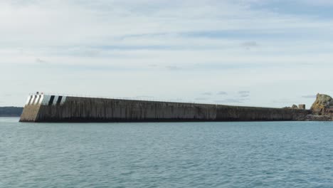 The-long-ancient-marine-wall-of-Jersey---Wide-shot