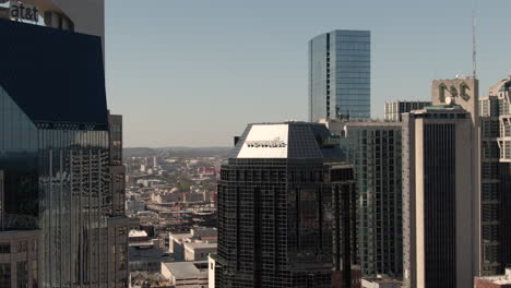 Aerial-view-of-Wework-logo-on-top-of-a-high-rise-building-in-downtown-Nashville,-Tennessee-on-a-clear,-fall-day