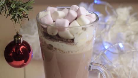 Whipped-cream-and-marshmallows-toppings-on-hot-chocolate-drink-at-Christmas