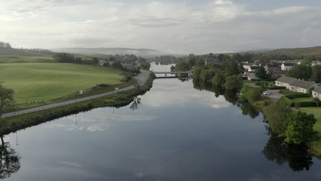 An-aerial-view-of-the-River-Shin-at-Lairg-on-a-calm-and-misty-summer's-moring