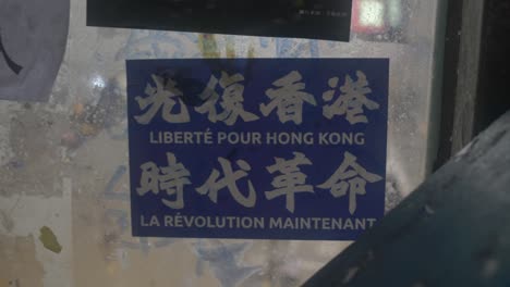 Track-in-Close-up-of-Free-Hong-Kong-sticker-in-French-and-Chinese