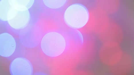 Defocused-view-of-flickering,-pink-and-blue-lights