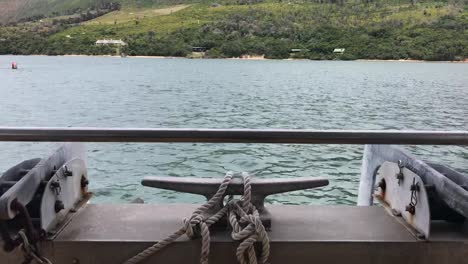 Bow-of-shuttle-ferry-with-large-cleat-and-ropes-in-Knysna,-S-Africa