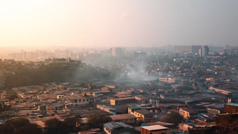 Timelapse-of-Smoke-rising-from-Slum-buildings-at-Sunset