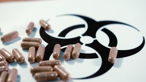 Pills-on-a-Biohazard-Symbol-Slowly-Rotating