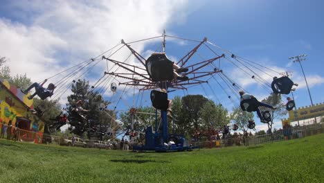 Time-lapse,-People-spinning-on-swing-chairs-on-carnival-amusement-ride