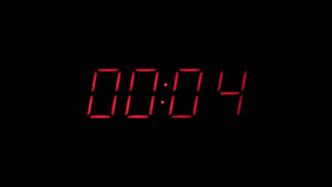 Red-digital-clock-countdown-to-zero-slow-zoom-in