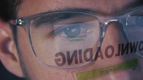 Man-downloads-data-from-the-Internet---Screen-reflects-on-the-glasses---Close-up