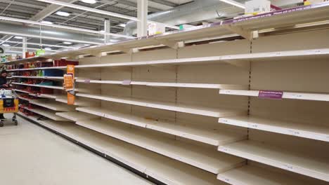 Panic-buying-and-stockpiling-in-supermarket,-Sainsbury's-in-the-UK,-occurring-as-a-result-of-the-Coronavirus-outbreak