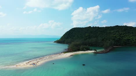 Aerial-view-of-small-uninhabited-cay-with-preserved-natural-exotic-forest-on-sunny-summer-day