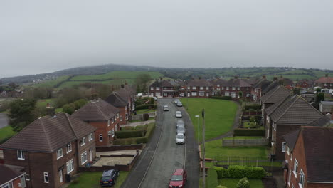 Aerial-view,-footage-of-a-council-housing-estate-in-Kidsgrove-Stoke-on-Trent,-flats,-homes-for-the-ever-growing-population,-immigration-and-poorer-areas-of-the-west-midlands,-cheap,-affordable-housing