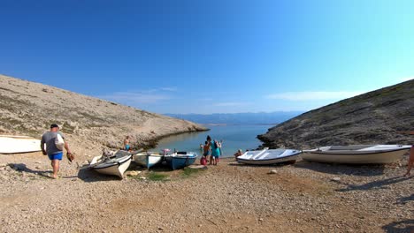 Summer-and-beautiful-hidden-cove-on-the-Adriatic-sea-with-boats-and-bathers