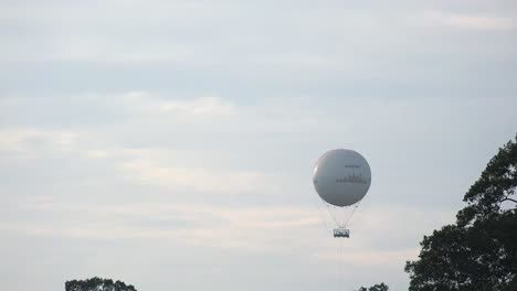 Medium-Exterior-Timelapse-Shot-of-Balloon-Landing-in-the-Air-in-the-Day