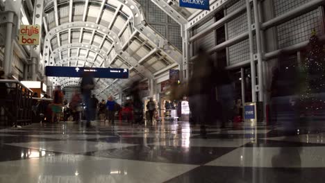 Panning-left-time-lapse-of-a-busy-airport-terminal-at-O'Hare-International-airport-on-Dec-26th