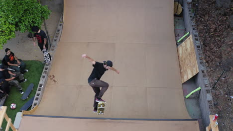 Skaters-riding-boards-on-Los-Angeles-backyard-skate-ramp