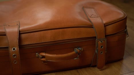 Old-brown-vintage-suitcase-medium-panning-shot