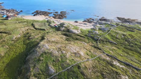 Camping-Tents-On-The-Rocky-Bay-Of-The-Beautiful-Coral-Strand-Beach-In-Connemara,-Ireland---aerial