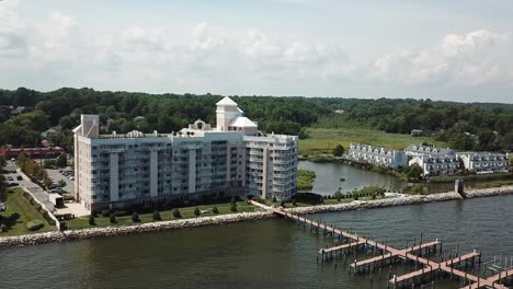 Aerial-View-on-Hotel-Resort-and-Waterfront-With-Dock-and-Boardwalk-on-Chesapeake-Beach-Bay,-Maryland-USA