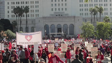Camera-Pans-Up-From-Large-Crowd-to-City-Hall-Building-at-LAUSD-Teacher's-Strike