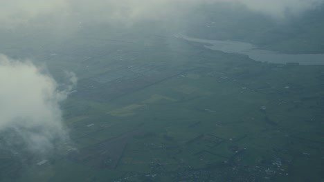 Aerial-View-From-Airplane-of-Clouds-and-Landscape