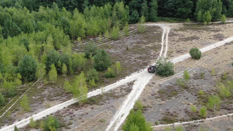 Aerial-View-of-an-Off-Road-Vehicle-on-Dirt-Roads-in-the-Countryside