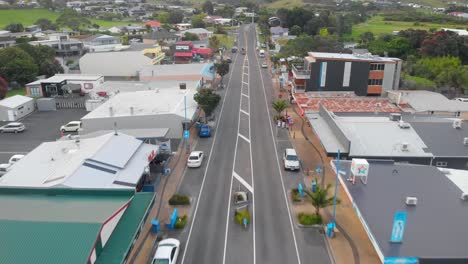 Aerial-view-of-the-main-street-on-Waihi-Beach,-Bay-of-Plenty-in-New-Zealand