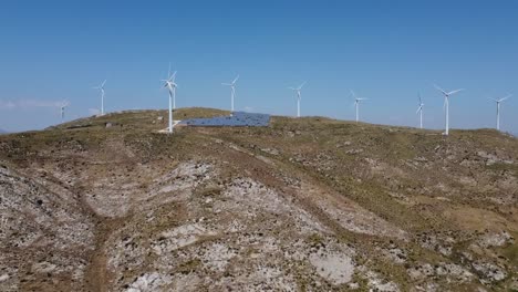 Wide-Aerial-panorama-shot-of-Windmills,-Wind-Turbines-on-mountain-hill-in-Sicily,Italy