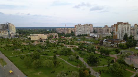 Aerial-view-around-the-Molodizhnyy-Park-and-the-Koledzh-Khoreohrafichnoho-Academy,-in-Troieshchyna-district,-cloudy-day,-in-Kiev-city,-Ukraine---orbit,-drone-shot