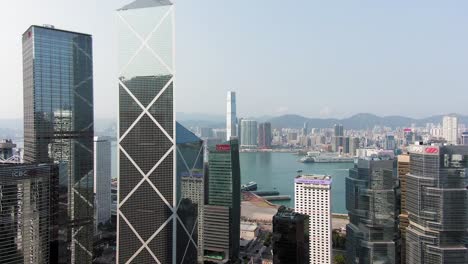 Hong-Kong-upscale-Wan-Chai-district-and-Victoria-Harbour-skyscrapers,-Aerial-view