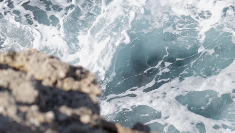 Slow-motion-of-rough-waves-crashing-on-the-rocky-cliff