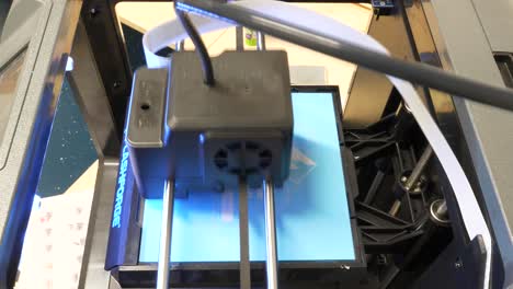 Time-Lapse-Top-Down-Shot-3D-Printer-Printing-an-Plastic-Model