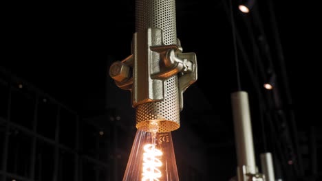Stylish-metal-lamp,-row-of-decorative-light-bulb,-modern,-industrial-interior