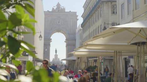 A-main-street-view-with-tourists-of-the-The-Rua-Augusta-Arch-Lisbon,-Portugal