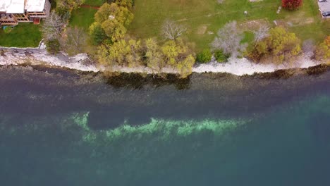 aerial-view-looking-down-at-shoreline-during-fall