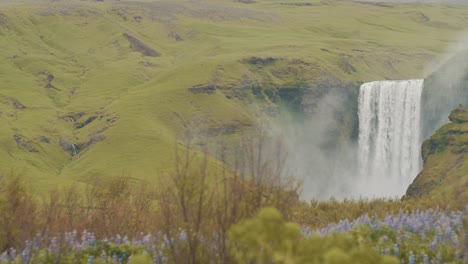 Slow-motion-shot-of-the-majestic-Skogafoss-waterfall,-an-iconic-destination-of-Iceland