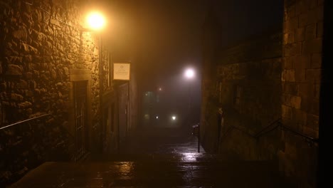 Castle-Wynd-North-in-Edinburgh-on-a-foggy-quiet-night---Zooming-out