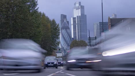 Timelapse-of-London-traffic-in-front-of-storm-brewing-over-large-office-buildings