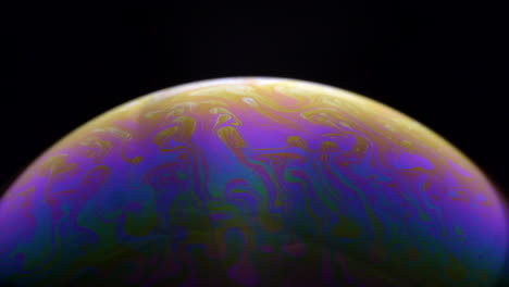 Beautiful-rainbow-bubble-planet-in-black-background--close-up