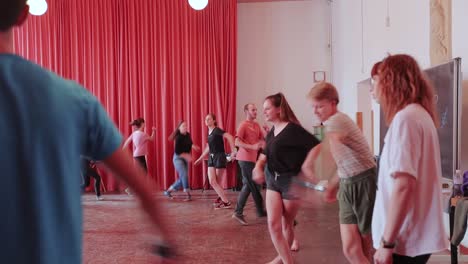 Teenage-Students-Learning-Dance-Choreography-In-The-Conference-Hall-At-Waldorf-School,-Netherlands---wide-shot
