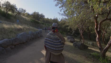 Shaman-walking-down-a-rural-path-in-Peru