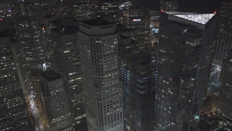 A-city-skyline-full-of-towering-skyscrapers-and-buildings-at-night