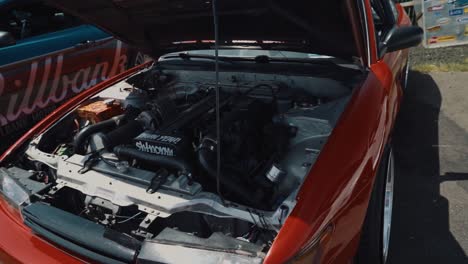 Arc-Shot-Revealing-the-Clean-Motor-of-a-Nissan-240SX-at-Car-Show