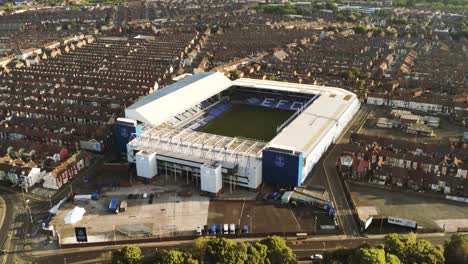 Iconic-Goodison-Everton-EFC-football-club-stadium-aerial-zoom-out-view-at-sunrise