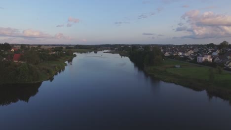 Flying-Forward-Over-The-Sirvinta-River-At-Evening
