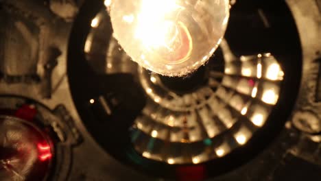 Slowly-moving-away-from-bottom-of-disco-ball,-bulb-having-great-details-starting-on-side-edge-and-moving-towards-top