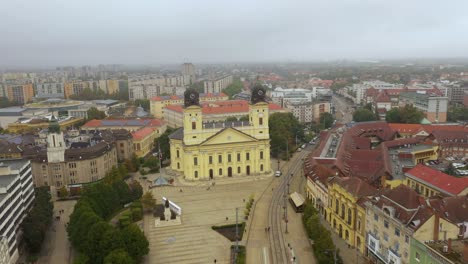Drone-footage-from-the-Church-at-Debrecen-citys-main-squarein-rainy-weather-autumn-Drone-flies-fast-backwards